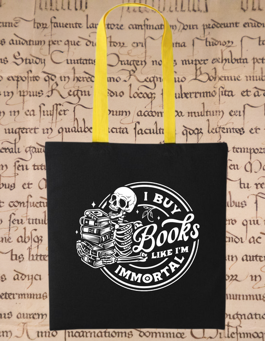 I Buy Books Like I’m Immortal Tote Bag – Gothic Skull Book Bag – Bookish Gift for Readers – Eco Cotton Tote for Book Addicts – Black & Yellow Handles